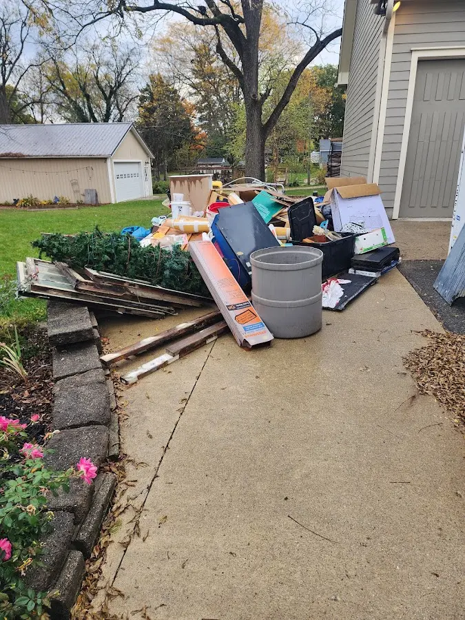 Dumpster being loaded with debris for Residential Dumpster Rental in Tyrone